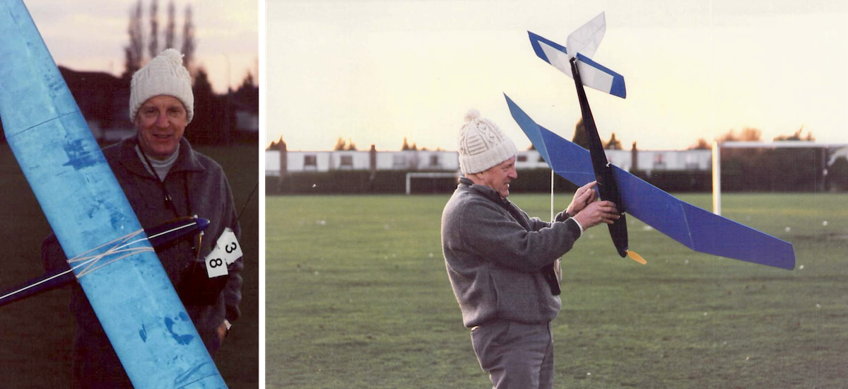 On the left, a man holds his radio-controlled model glider with a sunset sky in the background. The orientation of the photograph is portrait. He is wearing a white, knitted, Aran wool hat and a grey, fleece pullover. He is holding a radio-control transmitter used to control the glider. Two white tags are attached to the antenna of the transmitter with the numbers « 3 » and « 8 » on them, respectively. On the right is another photograph of the same man holding his radio-controlled model glider but in this case facing away from the camera. He is wearing a white, knitted, Aran wool hat and a grey, fleece pullover. A green, sports field is visible in the background along with soccer goalposts. (📸 Terence C. Gannon)